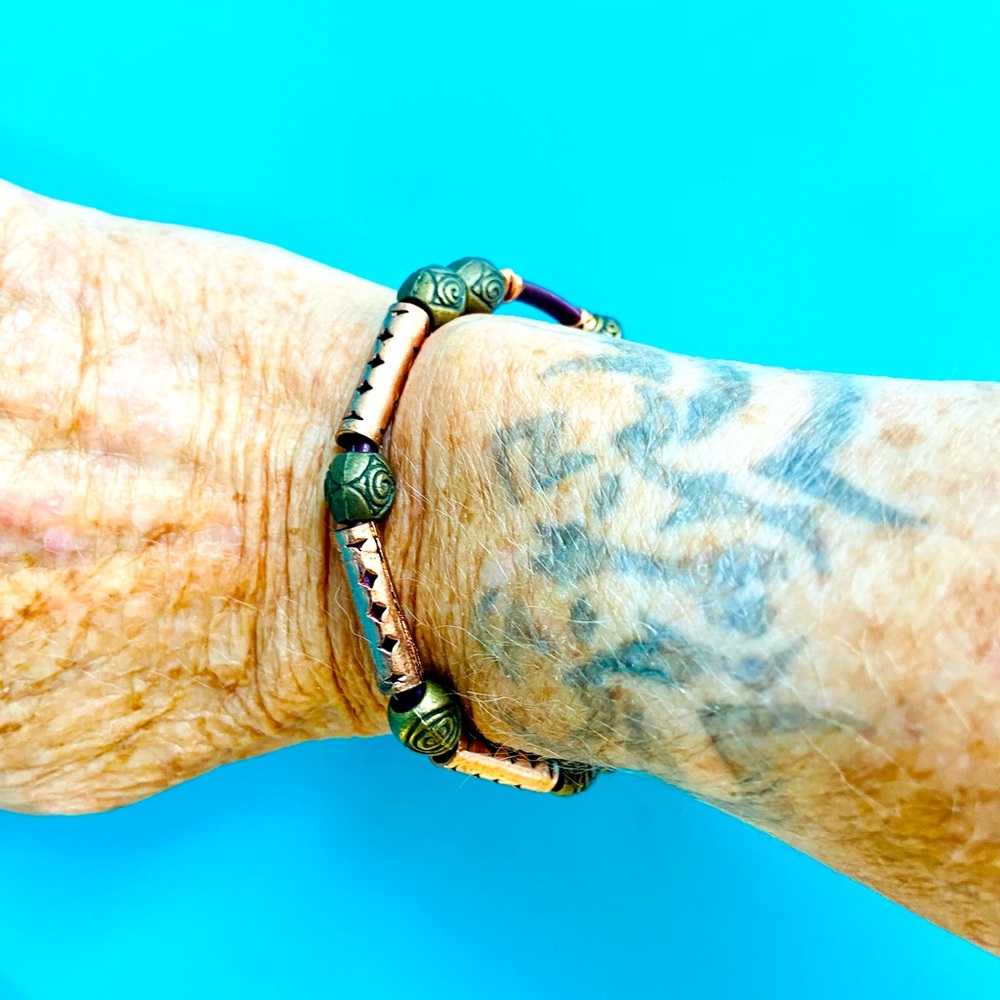 Wire-wrapped leather bracelet with copper, brass & silver.